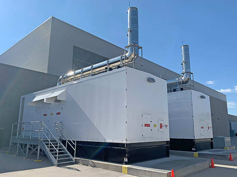 two large generators outside a data center 